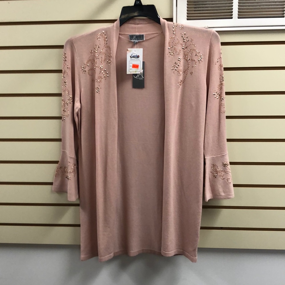 pink cardigan with peach colored detailing